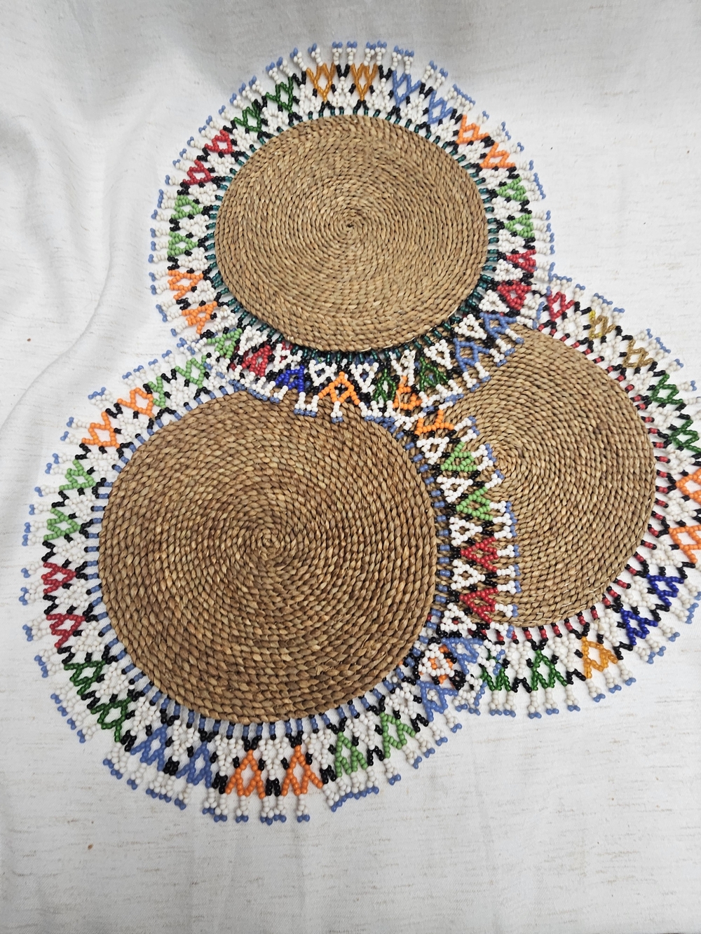 Handwoven Brown Rattan Coasters with Multicolor Beaded Trim